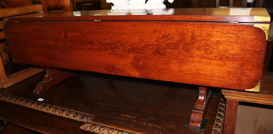 Captains style brass-bound rectangular drop-flap low table, with central compartment